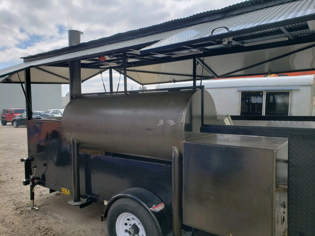 a food truck with a large smoker