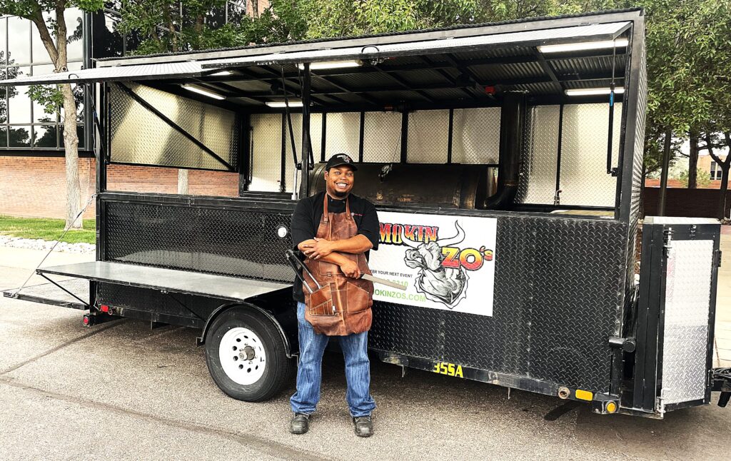 Smokin Zo next to an authentic texas food truck