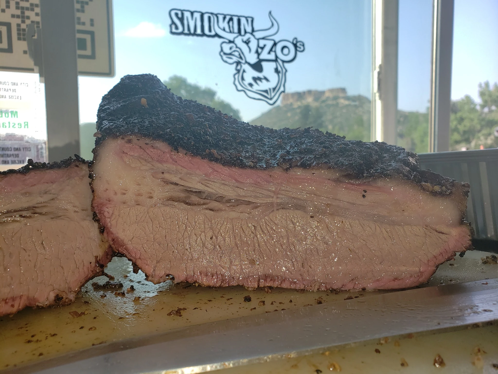 Sliced smoked brisket from Smokin Zo's